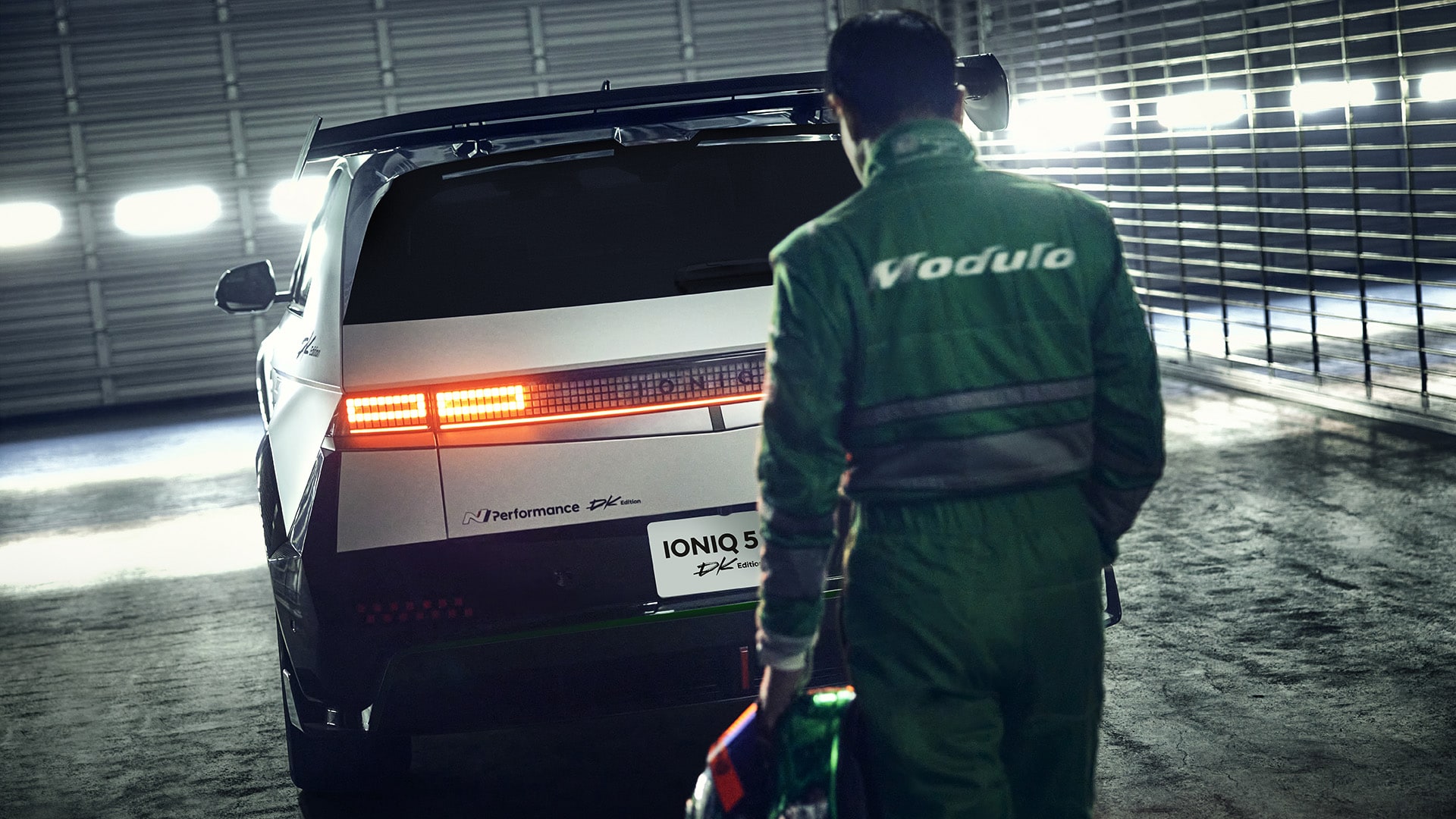 Photo image of a driver approaching the rear of an IONIQ 5 N DK Edition parked in a garage